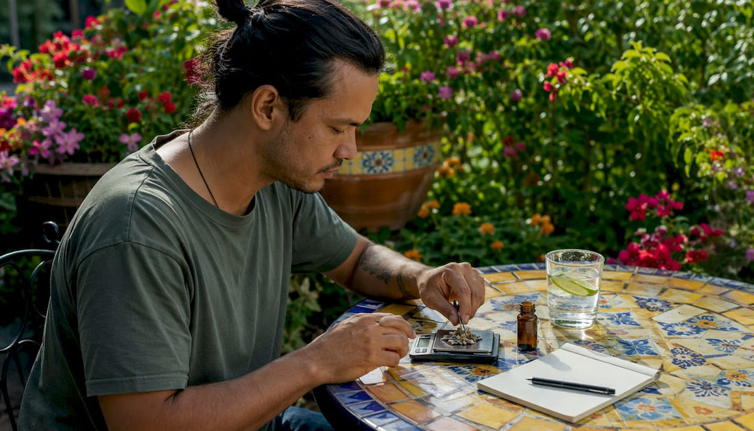 Person measuring psilocybin dose at kitchen table