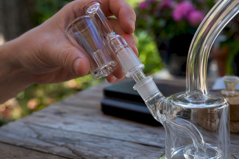 Hand attaching a reclaim catcher to dab rig