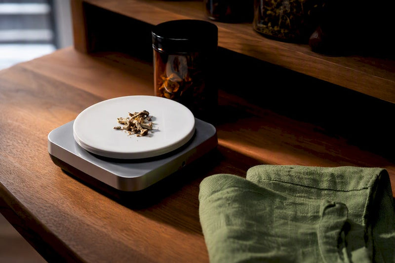 Milligram scale measuring a small mushroom dose