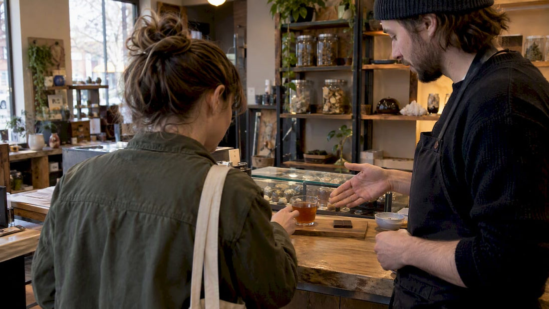Customer comparing mushroom tea and chocolate